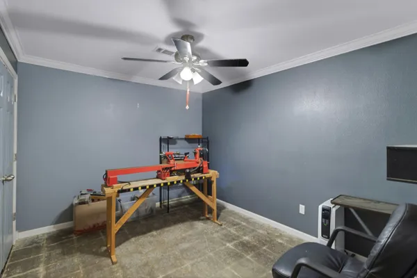 a bedroom with a workspace