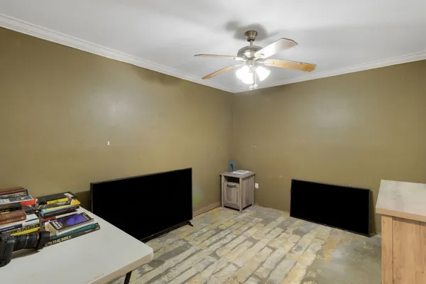 a bedroom with a bed and a bookshelf