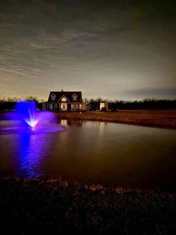 a view of a lake with a house