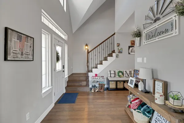 a living room with furniture and stairs