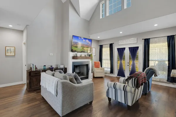 a living room with furniture and a fireplace
