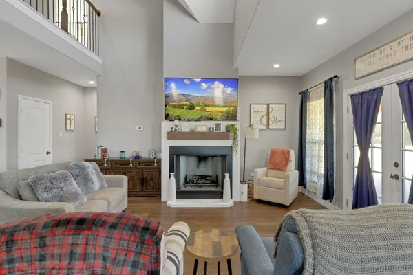 a living room with furniture and a fireplace