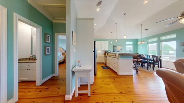 a kitchen with stainless steel appliances granite countertop a sink and a refrigerator