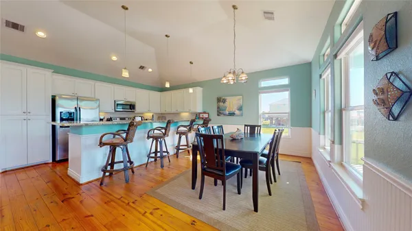 a view of a dining area with furniture window and wooden floor