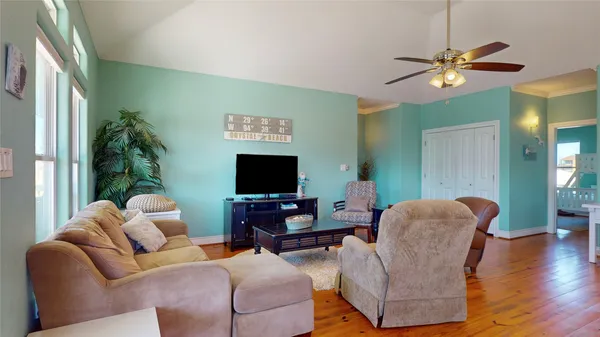a living room with furniture and a flat screen tv