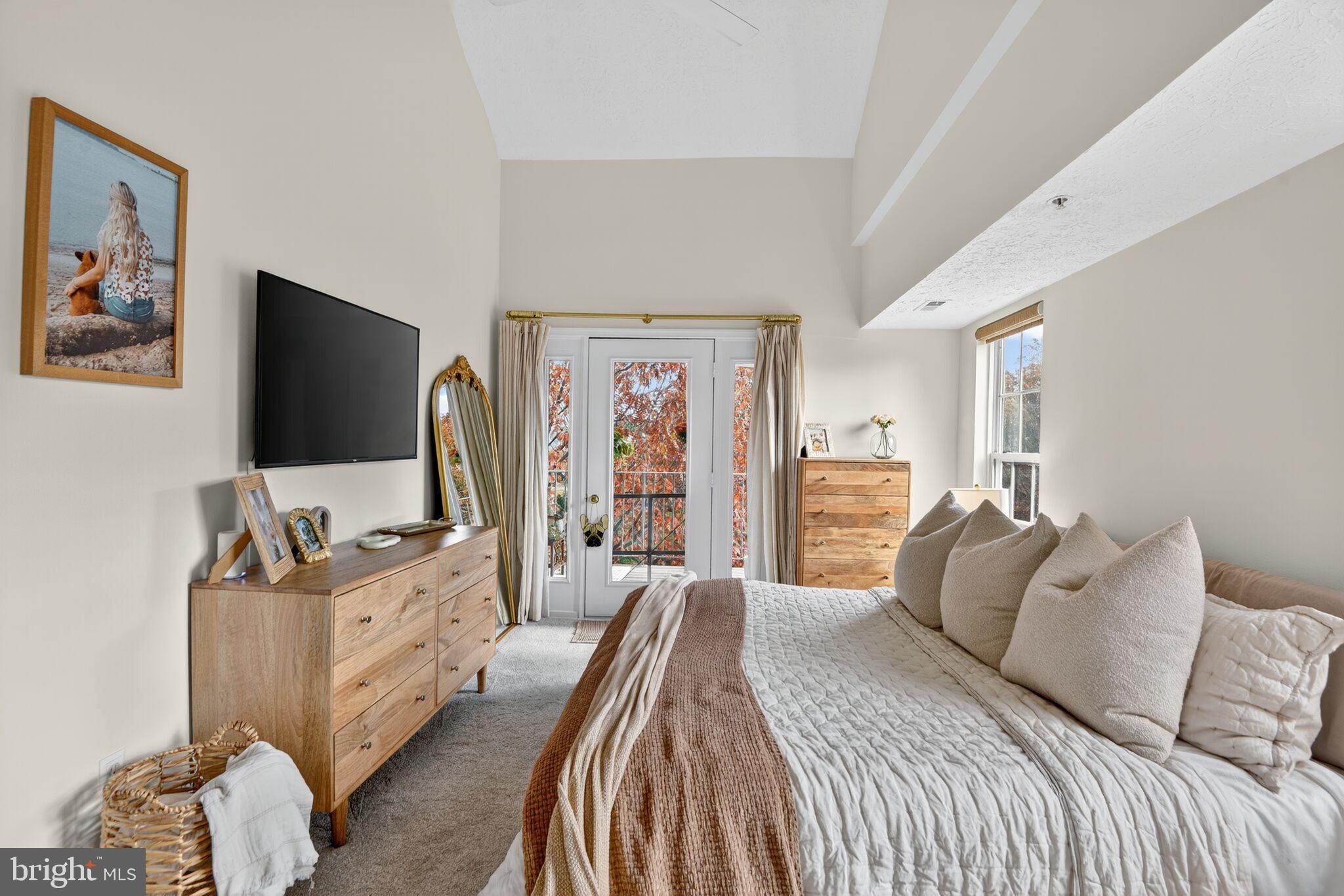 2013 Warners Terrace South, Unit 348 Annapolis, MD 21401 - Photo 15 of 23 a bedroom with a bed and a flat screen tv