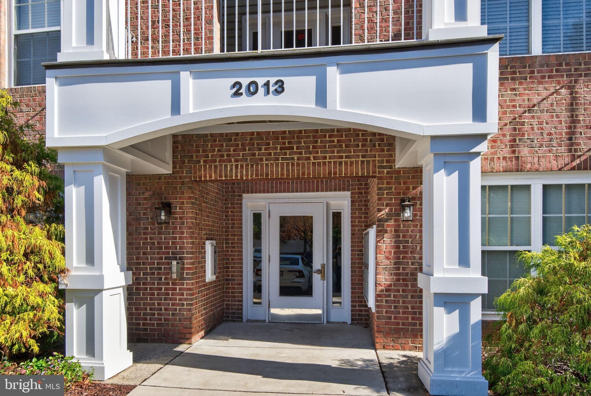 2013 Warners Terrace South, Unit 348 Annapolis, MD 21401 - Photo 2 of 23 a front view of a building with garden