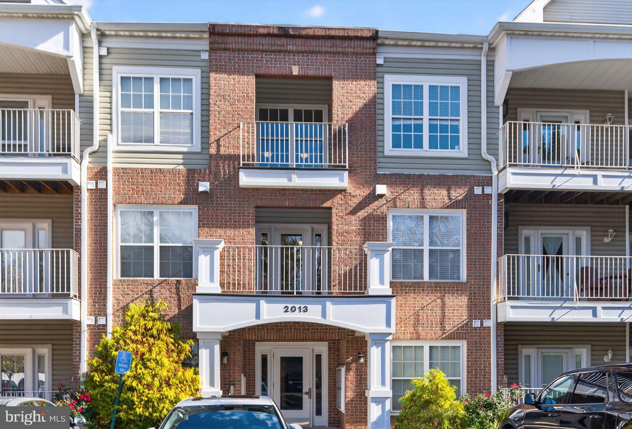 2013 Warners Terrace South, Unit 348 Annapolis, MD 21401 - Photo 3 of 23 a front view of a building with a lot of windows