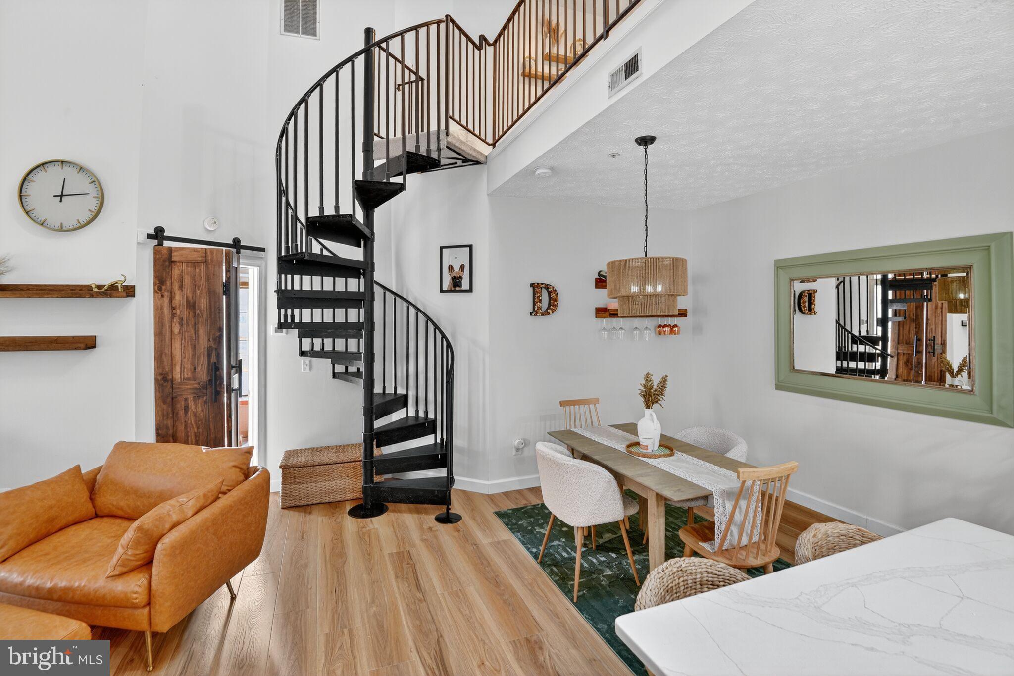 2013 Warners Terrace South, Unit 348 Annapolis, MD 21401 - Photo 4 of 23 a living room with wooden floor and furniture