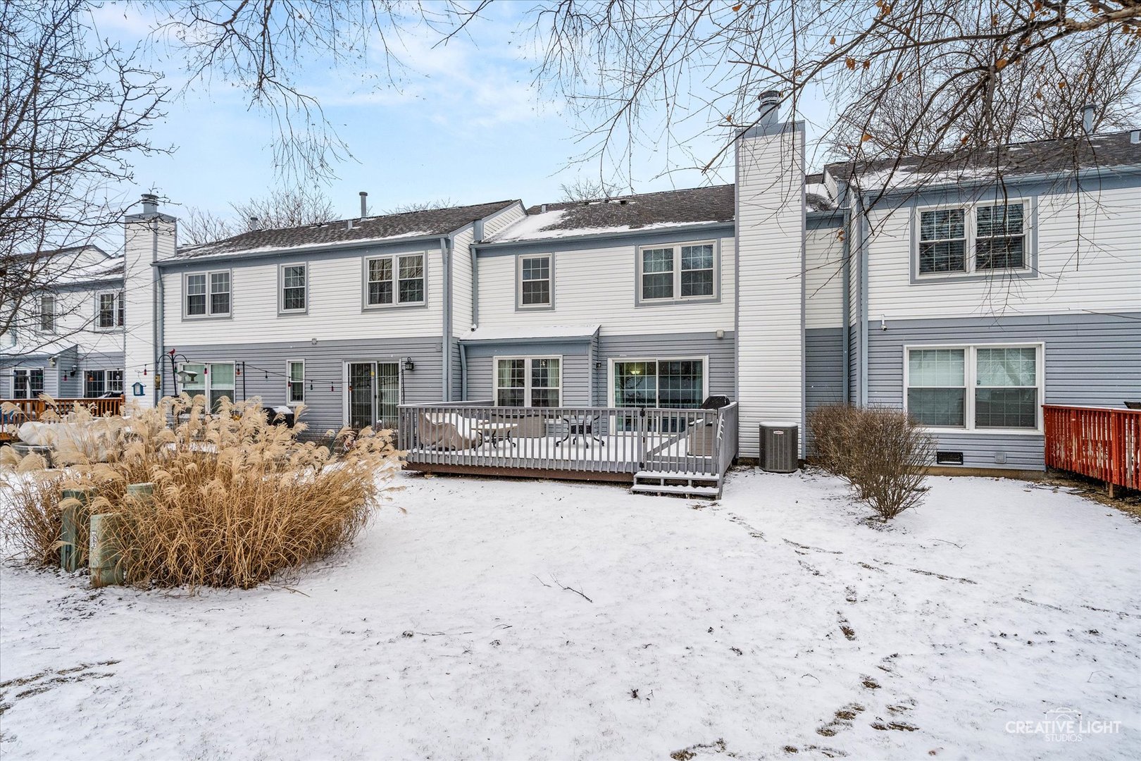 1712 Coach Drive Naperville, IL 60565 - Photo 29 of 39 a front view of a house with yard covered in snow