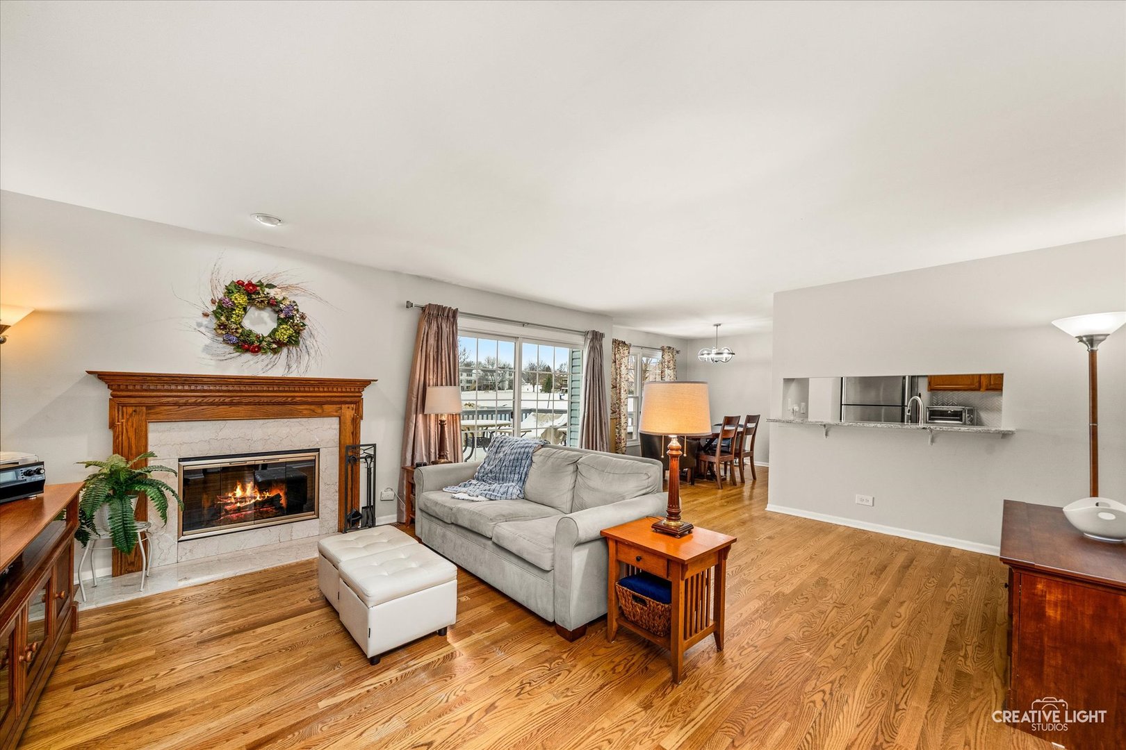 1712 Coach Drive Naperville, IL 60565 - Photo 3 of 39 a living room with furniture and a fireplace