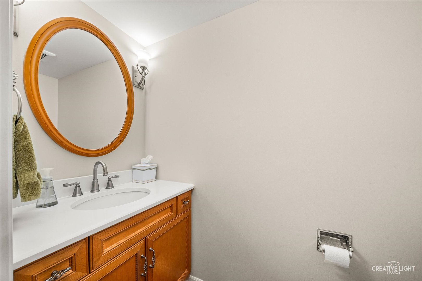 1712 Coach Drive Naperville, IL 60565 - Photo 10 of 39 a bathroom with a sink and a mirror