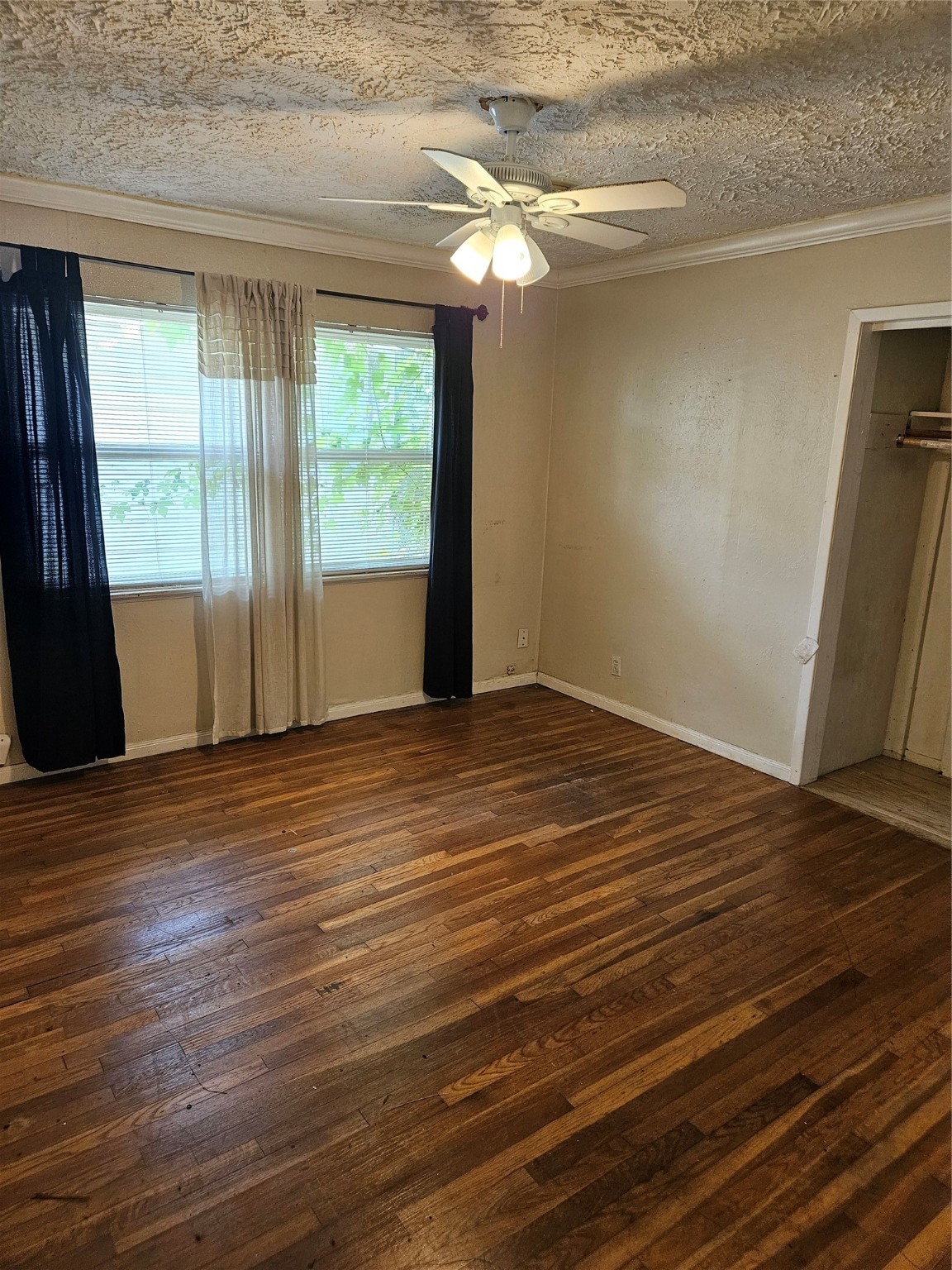 5218 Cortelyou Lane Houston, TX 77021 - Photo 23 of 45 a view of an empty room with wooden floor and a window