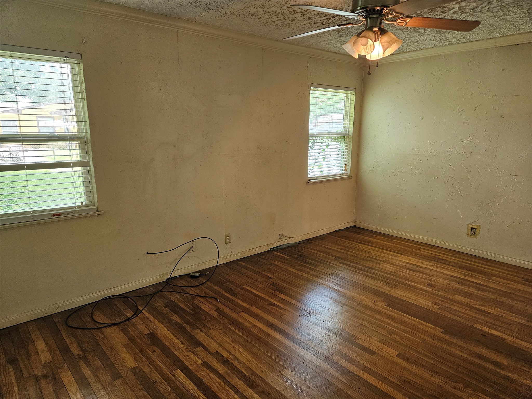 5218 Cortelyou Lane Houston, TX 77021 - Photo 28 of 45 a view of a room with wooden floor and fan