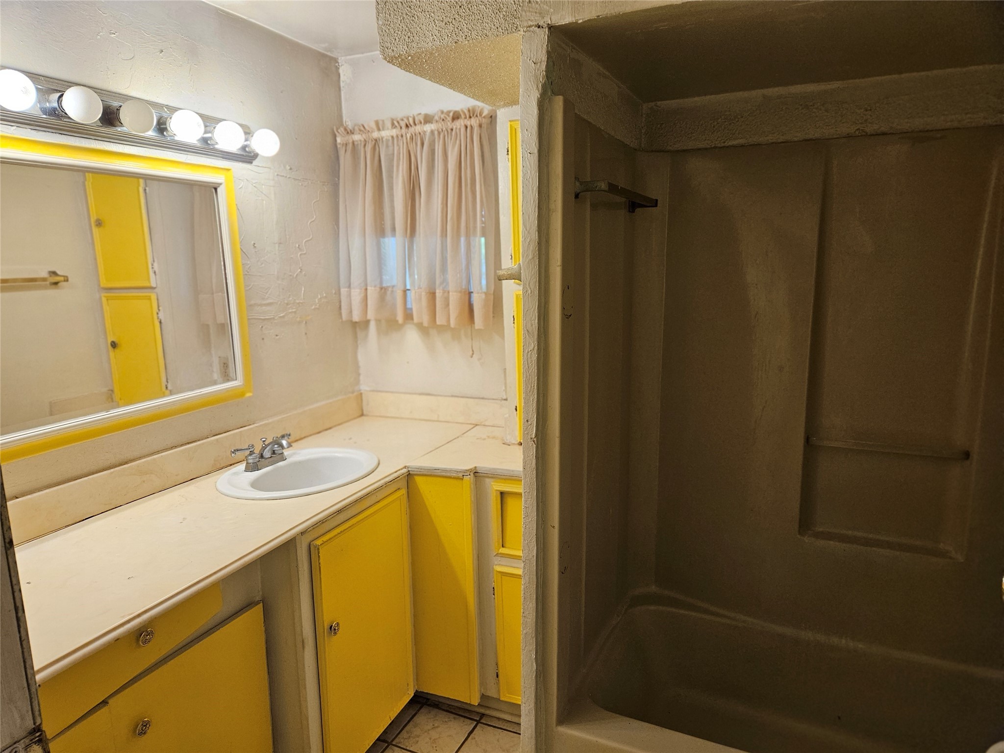 5218 Cortelyou Lane Houston, TX 77021 - Photo 30 of 45 a bathroom with a sink and a mirror