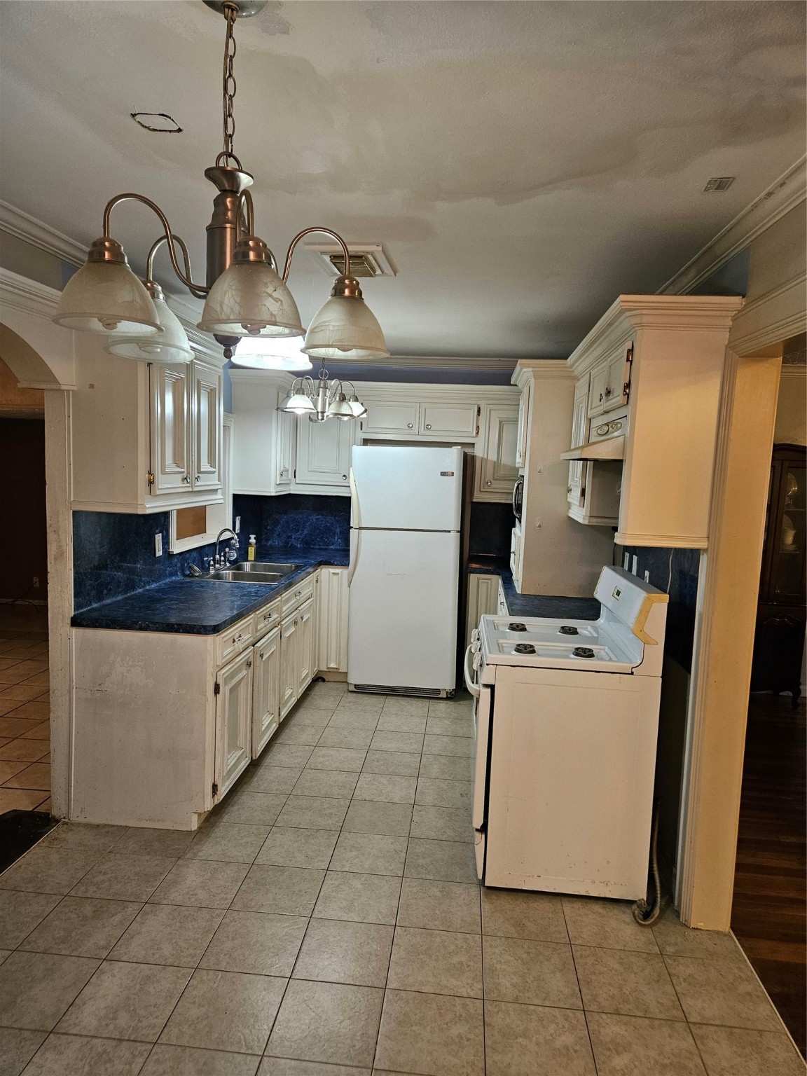 5218 Cortelyou Lane Houston, TX 77021 - Photo 37 of 45 a kitchen with a cabinets and white appliances