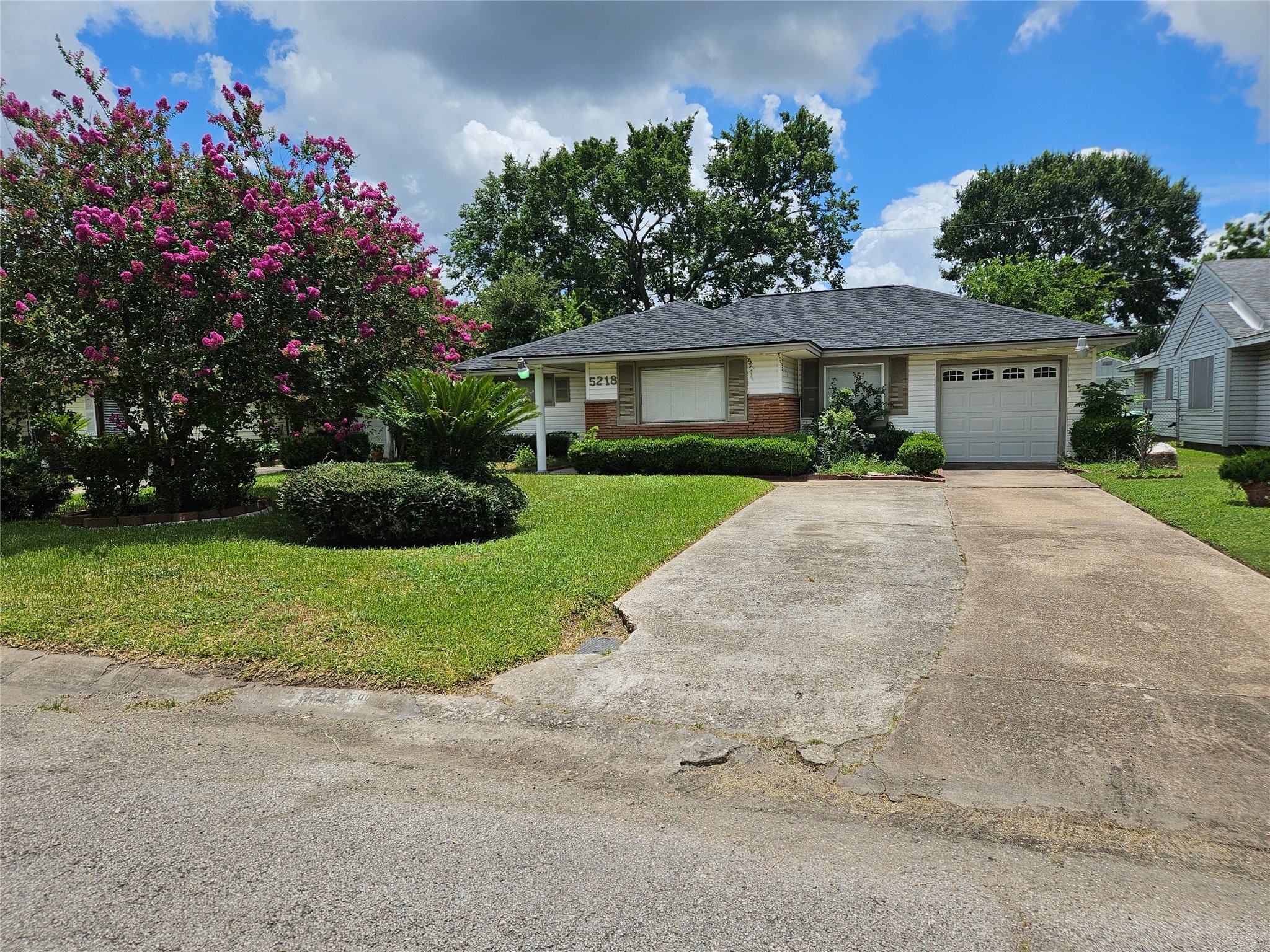 5218 Cortelyou Lane Houston, TX 77021 - Photo 7 of 45 a front view of a house with a yard and garage