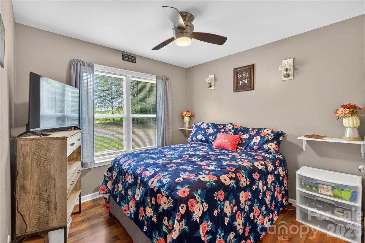 567 Godbey Road Mocksville, NC 27028 - Photo 11 of 38 a bed sitting in a bedroom next to a window