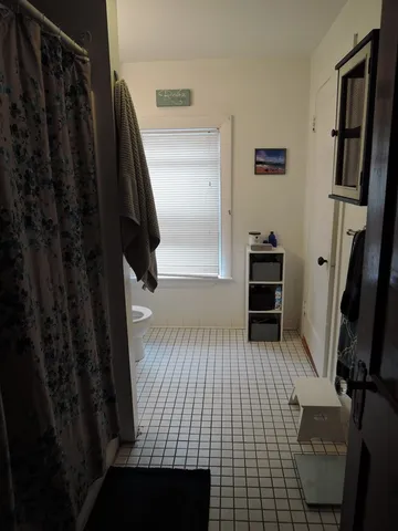 a view of wooden floor in a bathroom