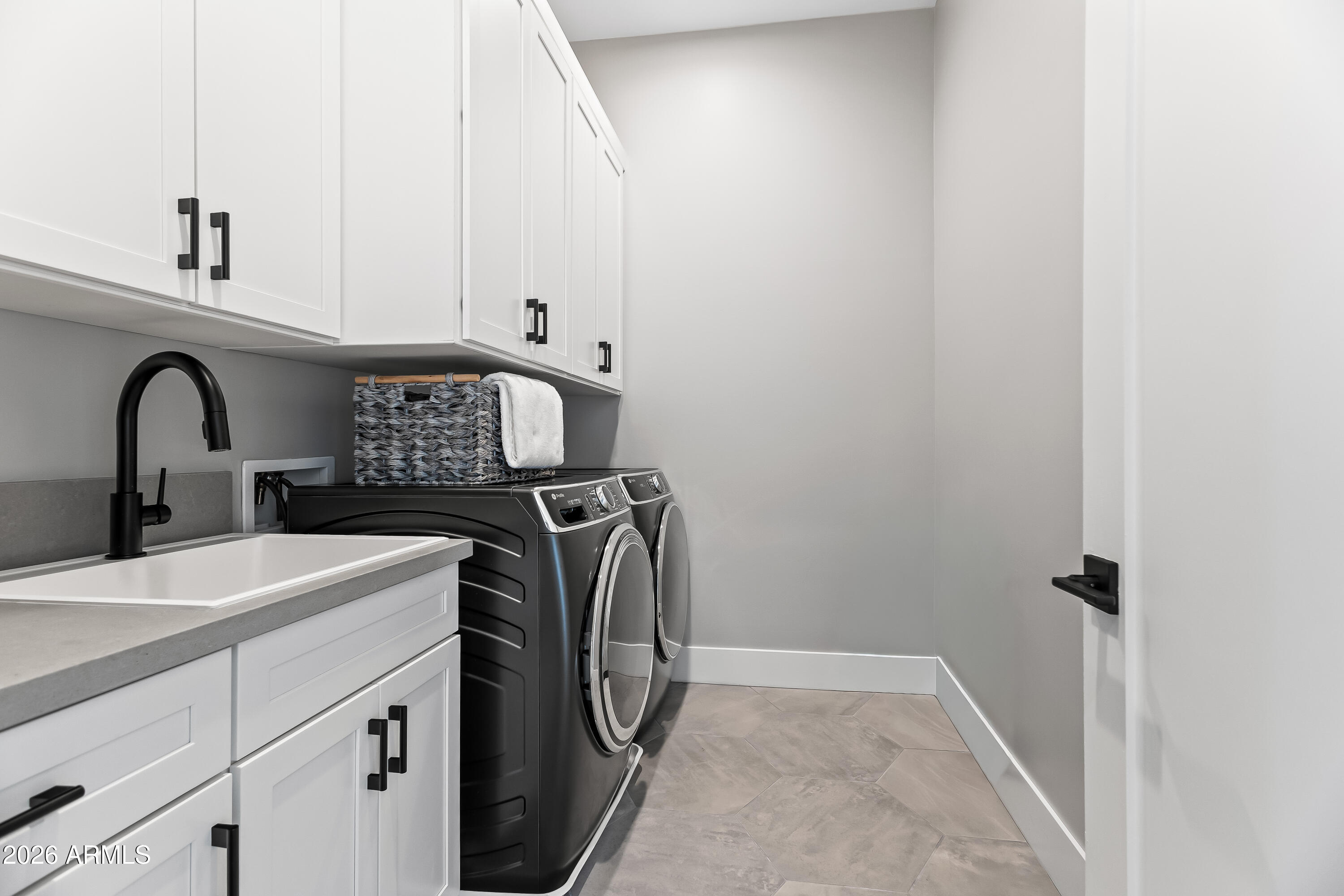 5136 North 10th Way Phoenix, AZ 85014 - Photo 36 of 42 Laundry with custom cabinetry