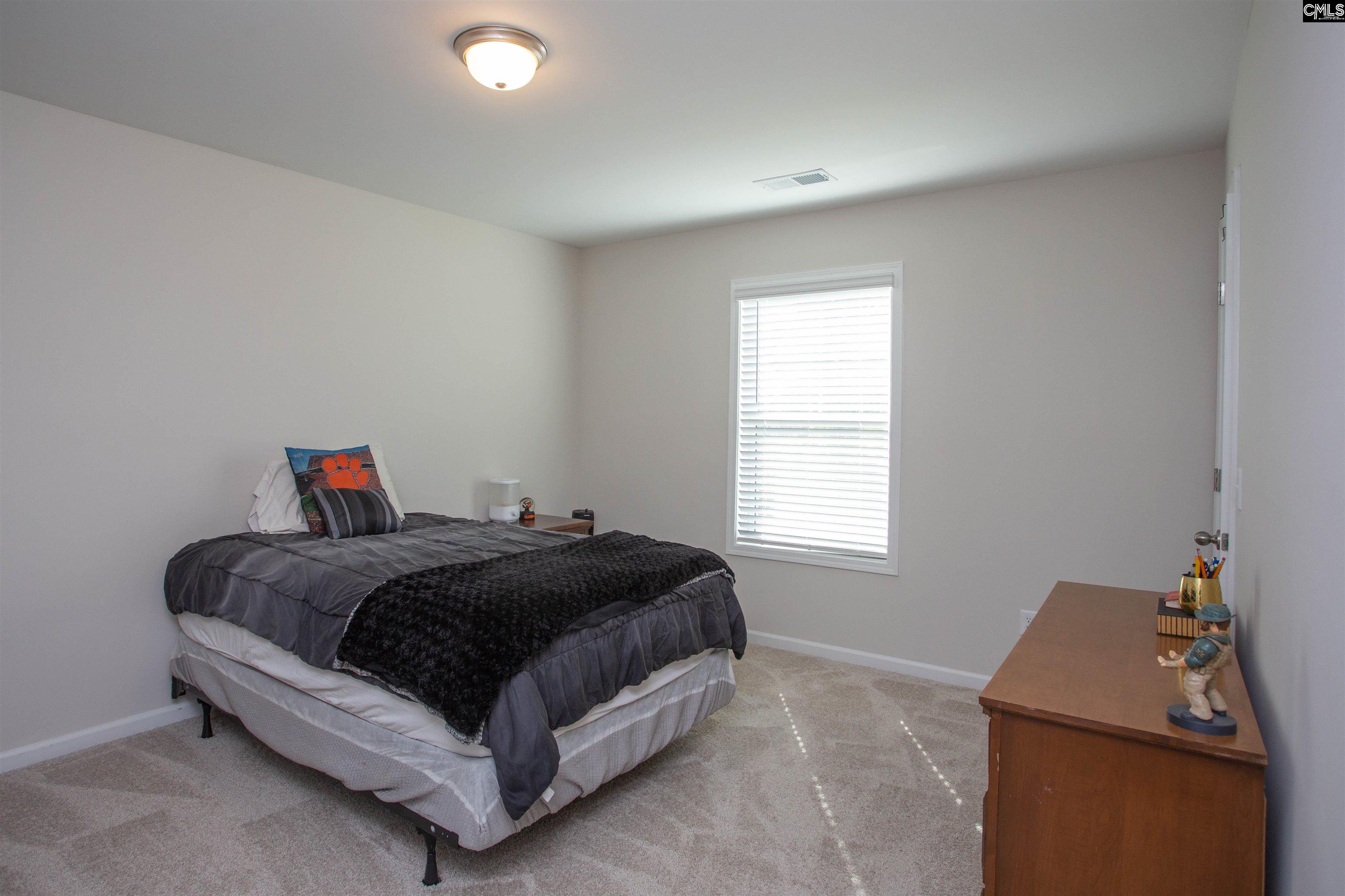 272 Shadowbrook Way Camden, SC 29020 - Photo 30 of 43 a bedroom with a bed and window