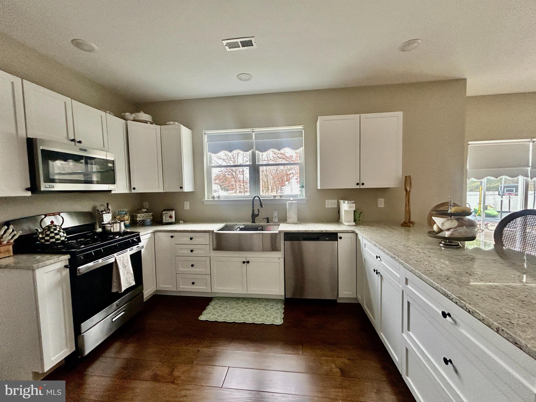 442 Waterfords Edge Court Atco, NJ 08004 - Photo 11 of 37 a kitchen with granite countertop white cabinets and appliances