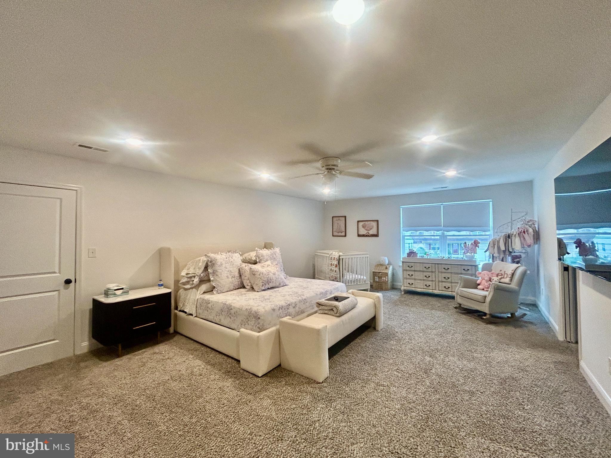 442 Waterfords Edge Court Atco, NJ 08004 - Photo 21 of 37 a spacious bedroom with a bed and a couch