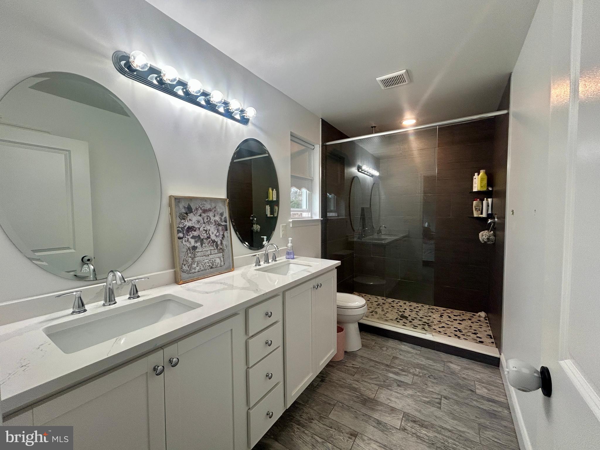 442 Waterfords Edge Court Atco, NJ 08004 - Photo 26 of 37 a bathroom with a double vanity sink mirror and shower