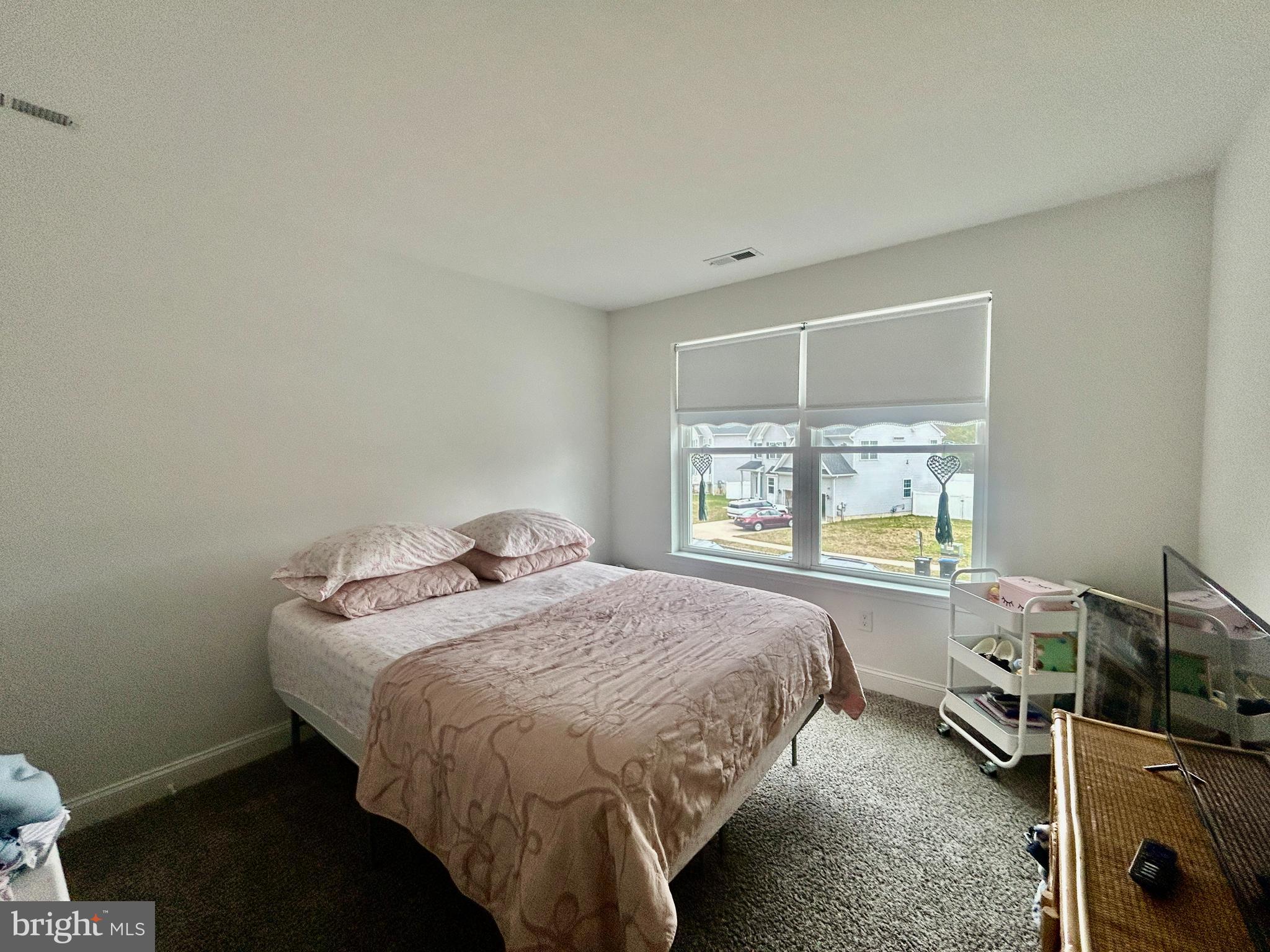 442 Waterfords Edge Court Atco, NJ 08004 - Photo 27 of 37 a bed sitting in a room next to a window