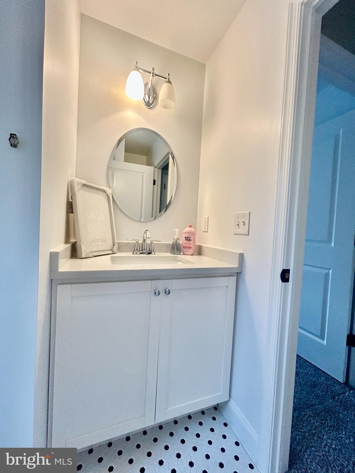 442 Waterfords Edge Court Atco, NJ 08004 - Photo 29 of 37 a bathroom with a sink and a mirror
