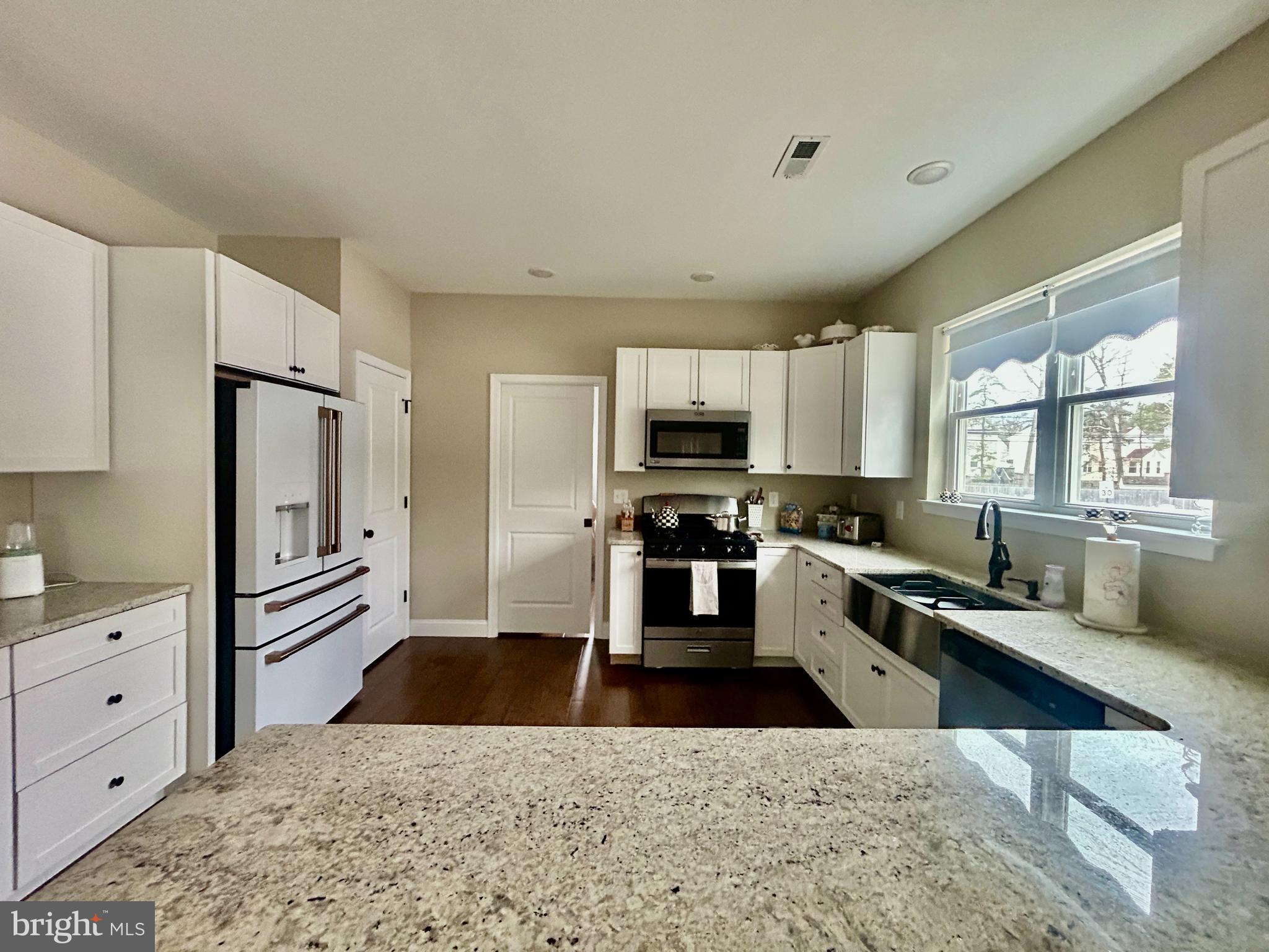 442 Waterfords Edge Court Atco, NJ 08004 - Photo 10 of 37 a kitchen with stainless steel appliances kitchen island granite countertop a sink dishwasher stove and refrigerator