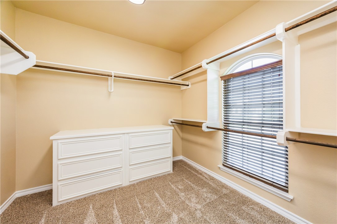 307 Heathercrest Portland, TX 78374 - Photo 21 of 40 a view of walk in closet with empty racks