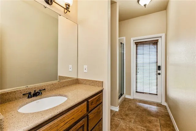 a bathroom with a toilet a sink and a window