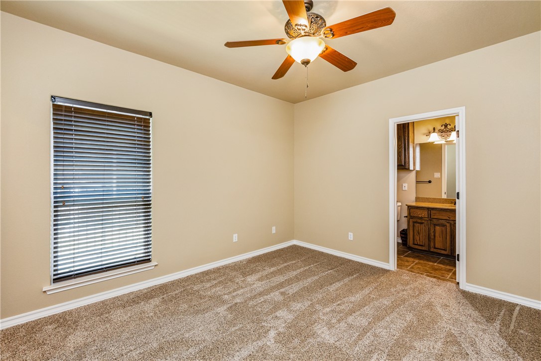 307 Heathercrest Portland, TX 78374 - Photo 26 of 40 an empty room with windows and fan
