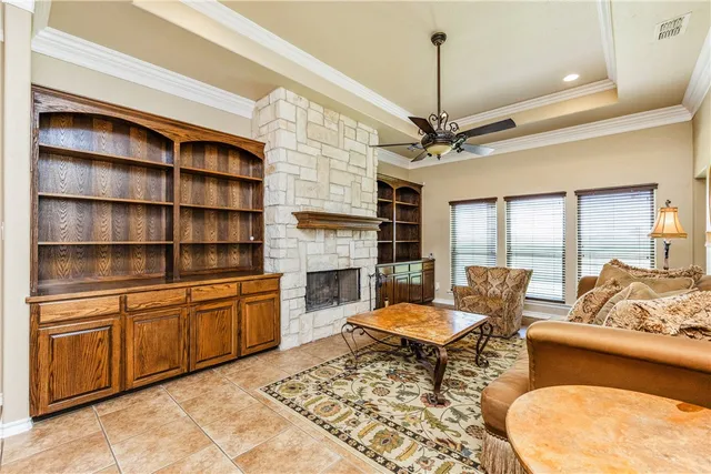 a living room with furniture fireplace and a flat screen tv