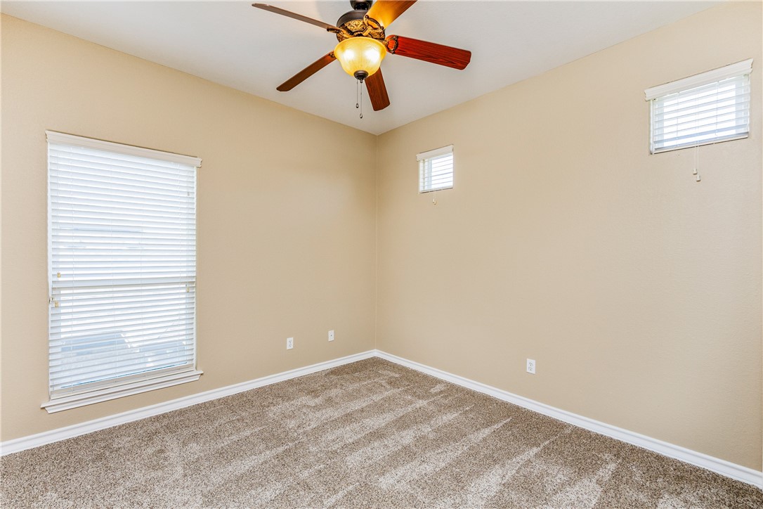 307 Heathercrest Portland, TX 78374 - Photo 34 of 40 an empty room with windows and fan