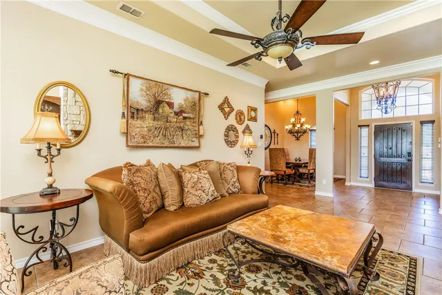 a living room with couch and a dining table