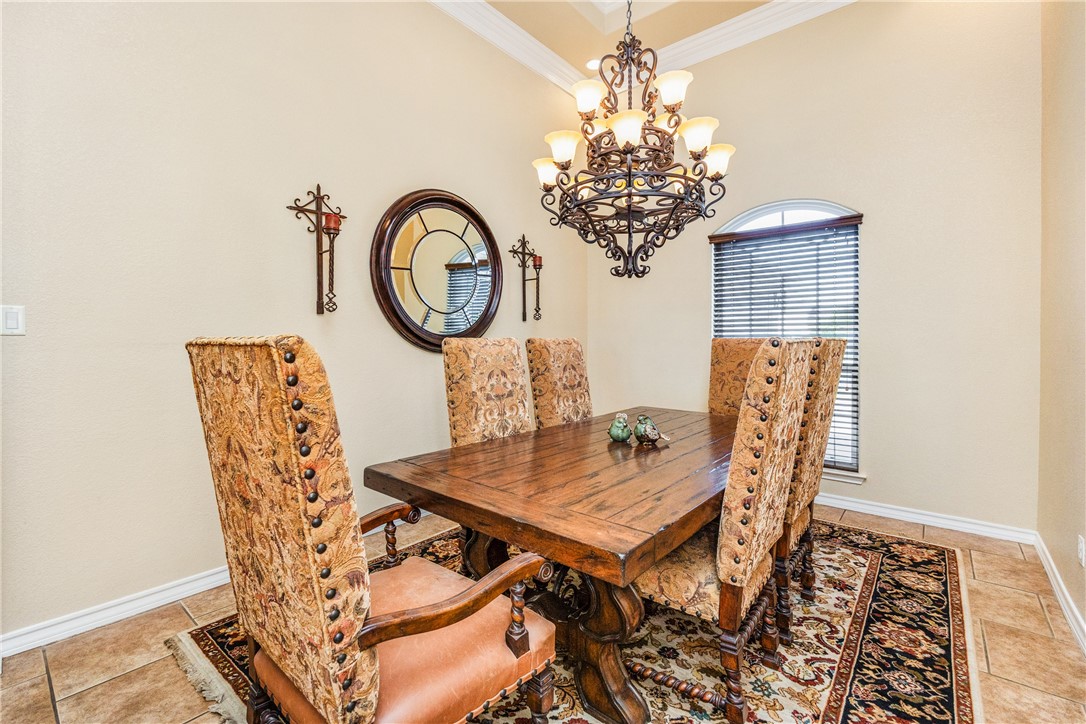 307 Heathercrest Portland, TX 78374 - Photo 7 of 40 a view of a dining room with furniture and chandelier