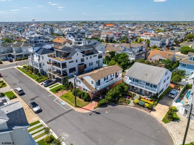 an aerial view of a house with a garden