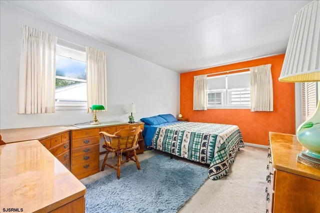 a room with a bed and a window