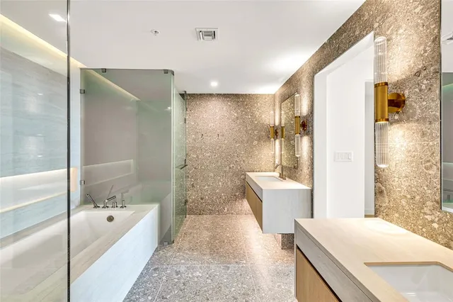 a utility room with sink dryer and washer