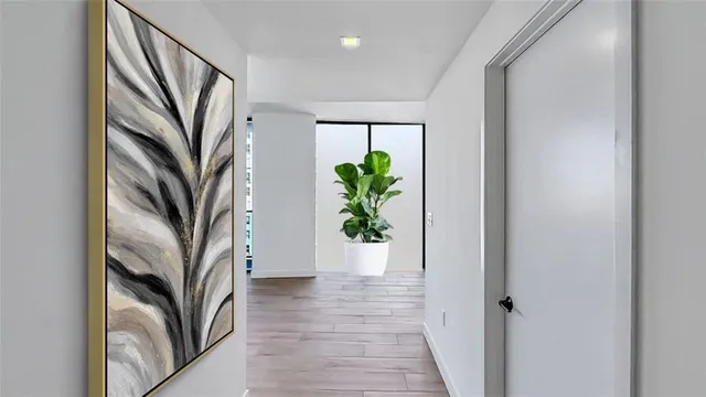 a view of a kitchen with a sink and cabinets