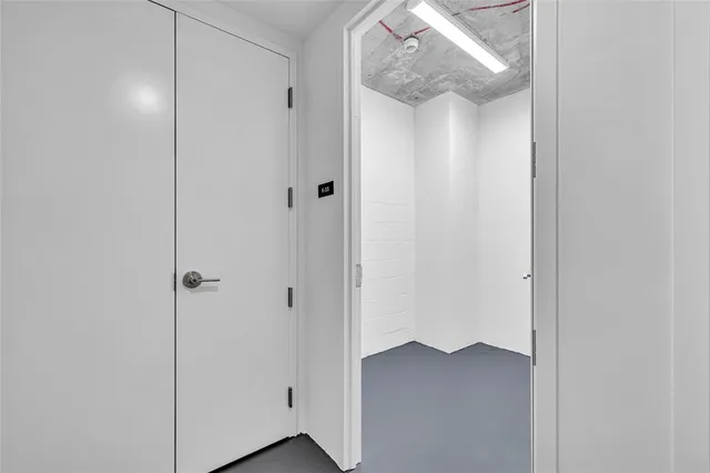 a view of a dining room with furniture and a chandelier