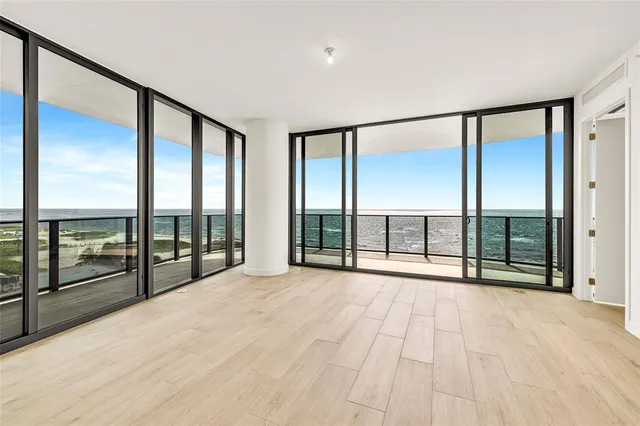 a view of an entryway with wooden floor