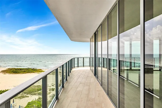 a large kitchen with stainless steel appliances a large window and counter space
