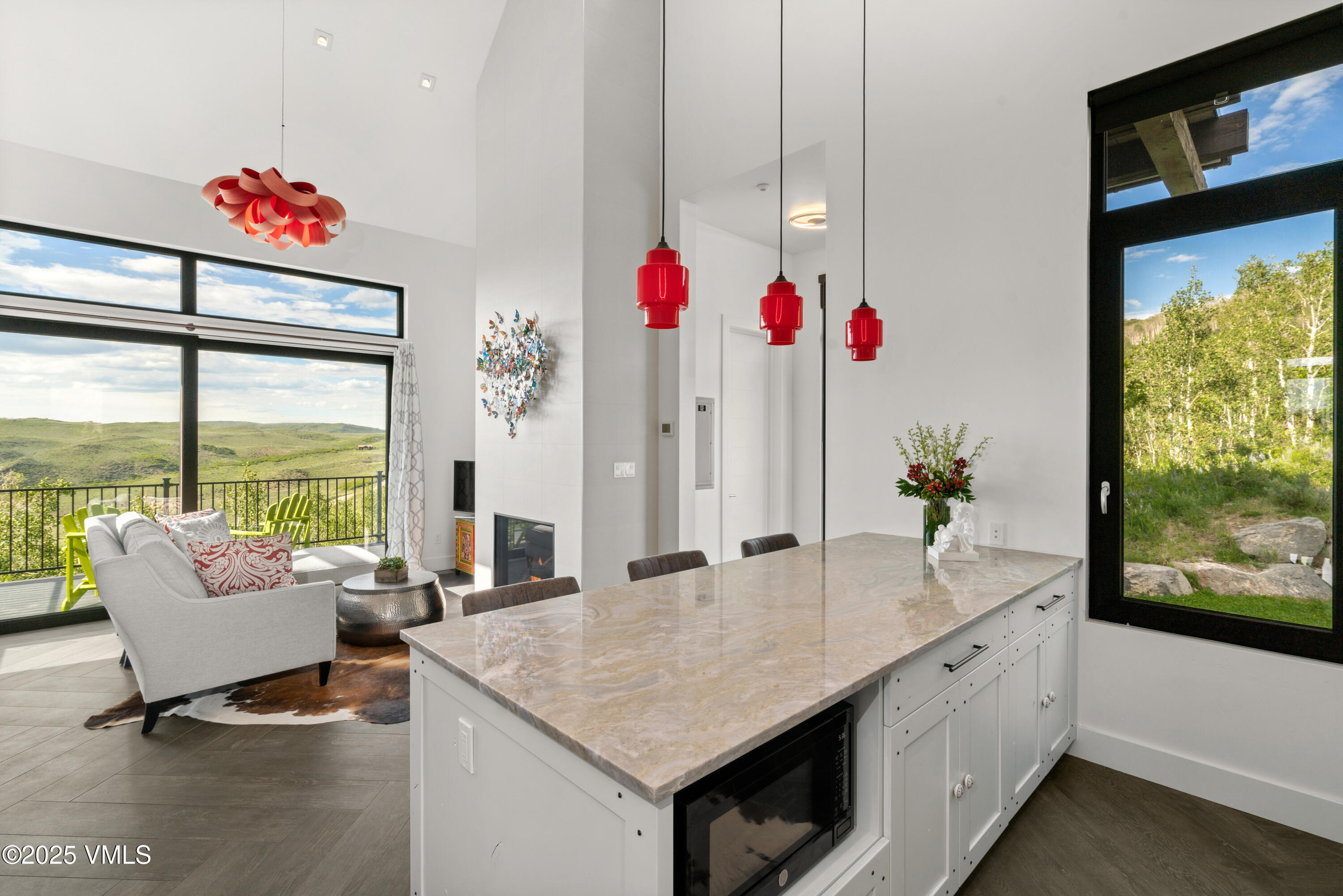 594 Winchester Trail Edwards, CO 81632 - Photo 36 of 46 a living room with kitchen island granite countertop furniture and a potted plant