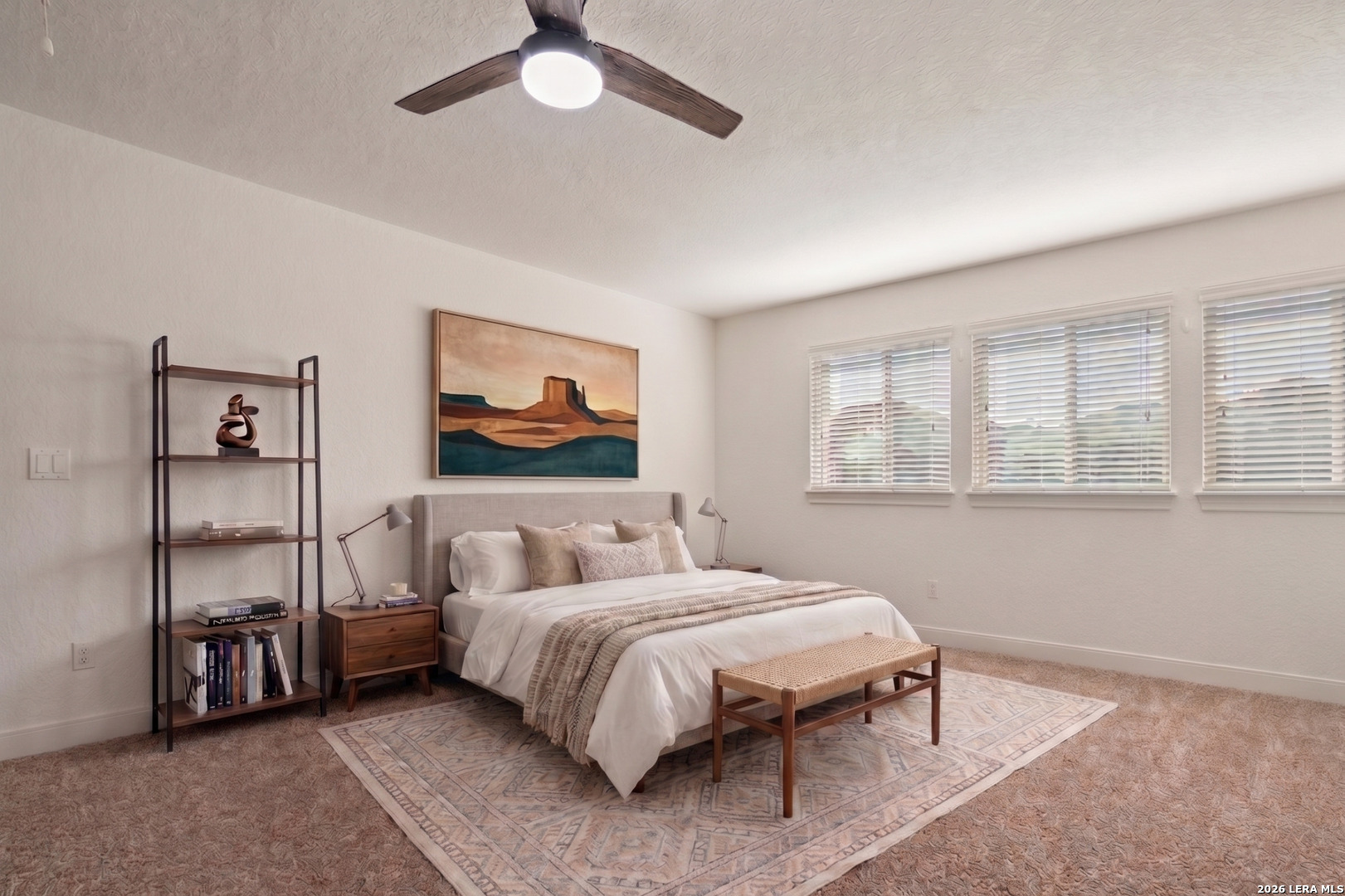 28827 Pfeiffers Gate Fair Oaks Ranch, TX 78015 - Photo 22 of 36 a bedroom with a bed and a painting on the wall