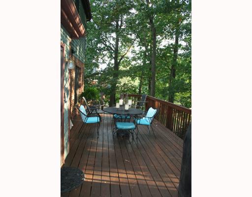 Patio/Deck. Large rear deck perfect for entertaining or enjoying a quiet moment.