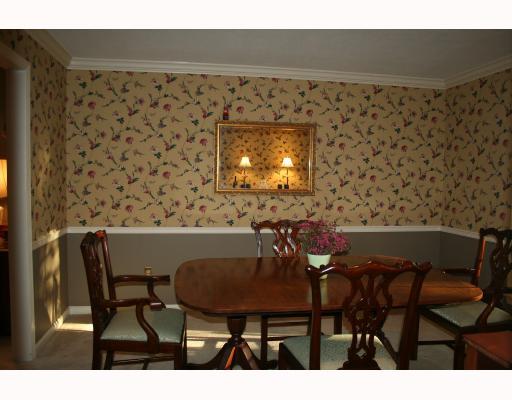 Dining Room. A large, recently replaced, sliding window makes for a refreshing dinner aptmosphere in the dining room.
