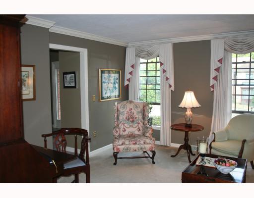 Living Room. A bright room with crown moulding make this a perfect gathering place for guests.